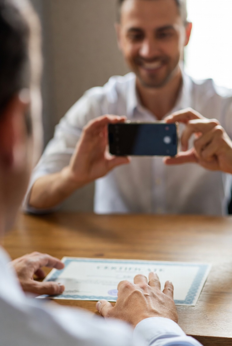 HR professional verifying a candidate's certificate